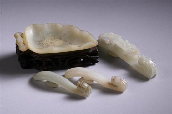 Appraisal: CHINESE JADE LEAF-FORM BRUSH WASHER Together with three light celadon