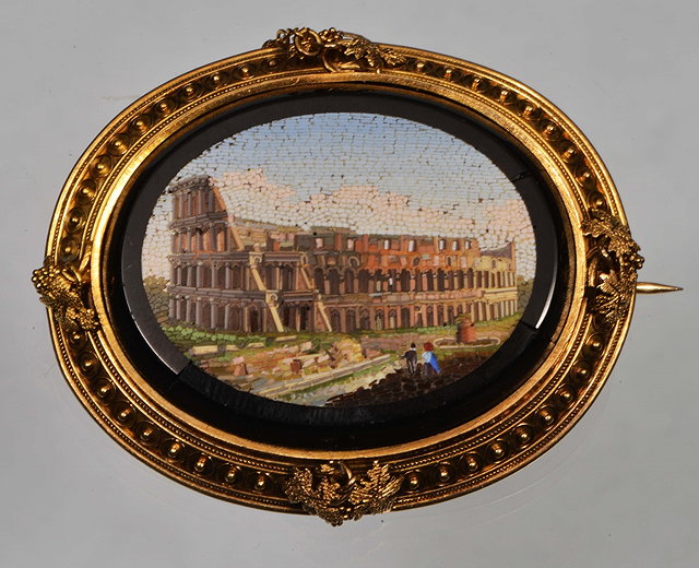 Appraisal: AN ITALIAN OVAL MICRO MOSAIC depicting the Colosseum mounted in