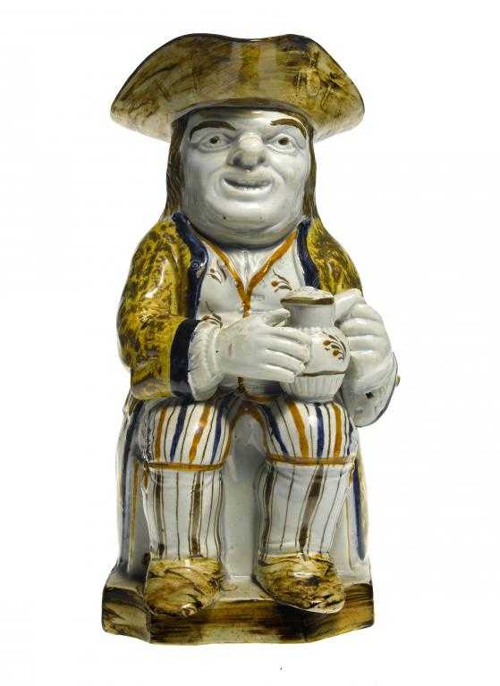 Appraisal: A PRATT WARE TOBY JUG the seated toper holding a