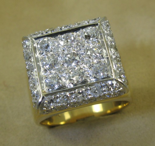 Appraisal: DIAMOND AND FOURTEEN KARAT GOLD RING set with round-cut diamonds