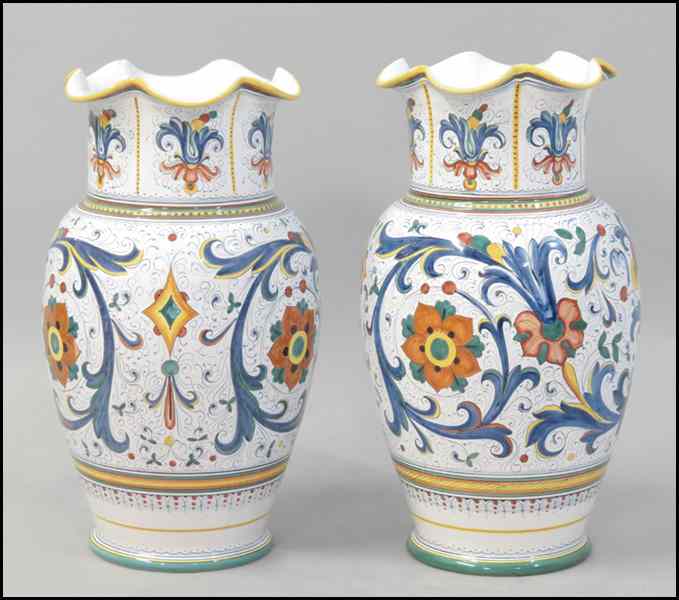 Appraisal: PAIR OF CAMA DERUTA PAINTED CERAMIC URNS Bearing a scalloped