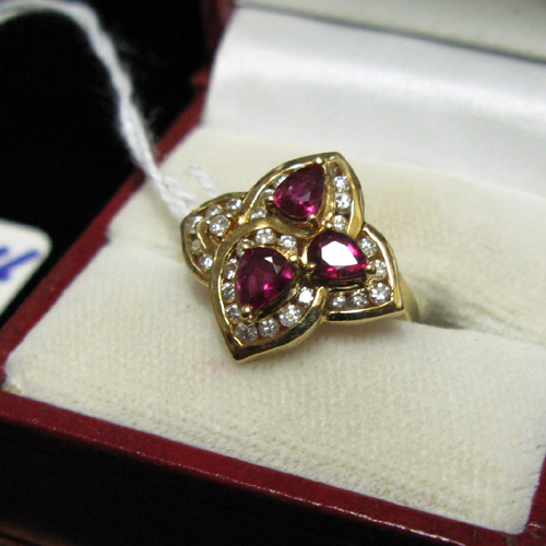 Appraisal: RUBY DIAMOND AND FOURTEEN KARAT GOLD RING The quatrefoil-shaped setting