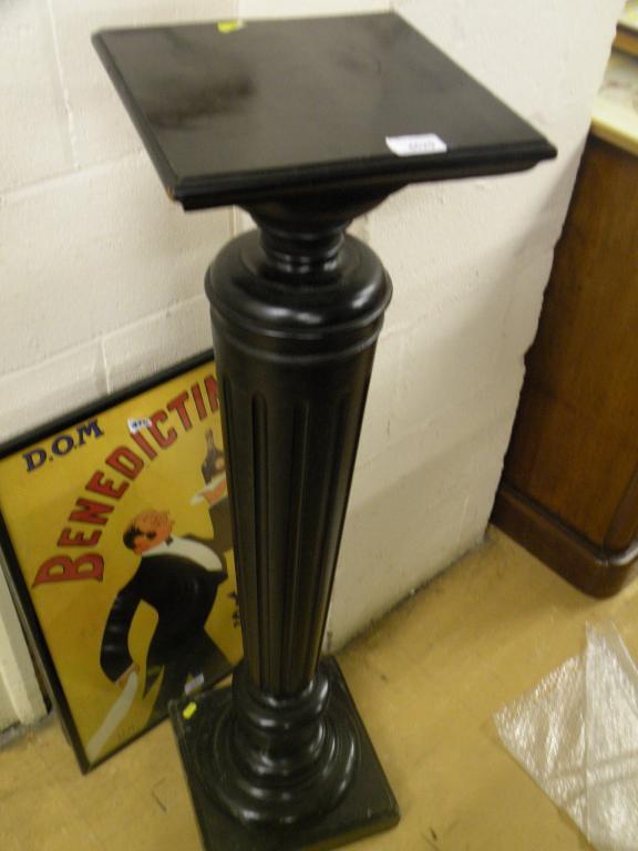 Appraisal: A Victorian ebonised torchere on a fluted tapering column and