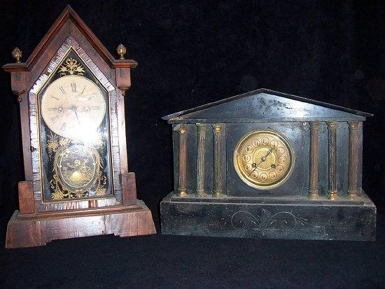 Appraisal: A black marble mantel clock in an architectural case fitted