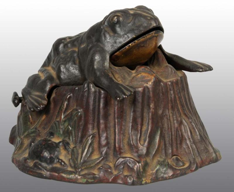 Appraisal: Cast Iron Frog on Stump Mechanical Bank Description Manufactured by