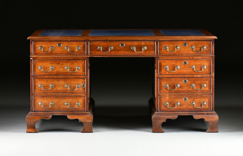 Appraisal: A GEORGE II STYLE WALNUT BLUE LEATHER TOP PARTNER'S DESK