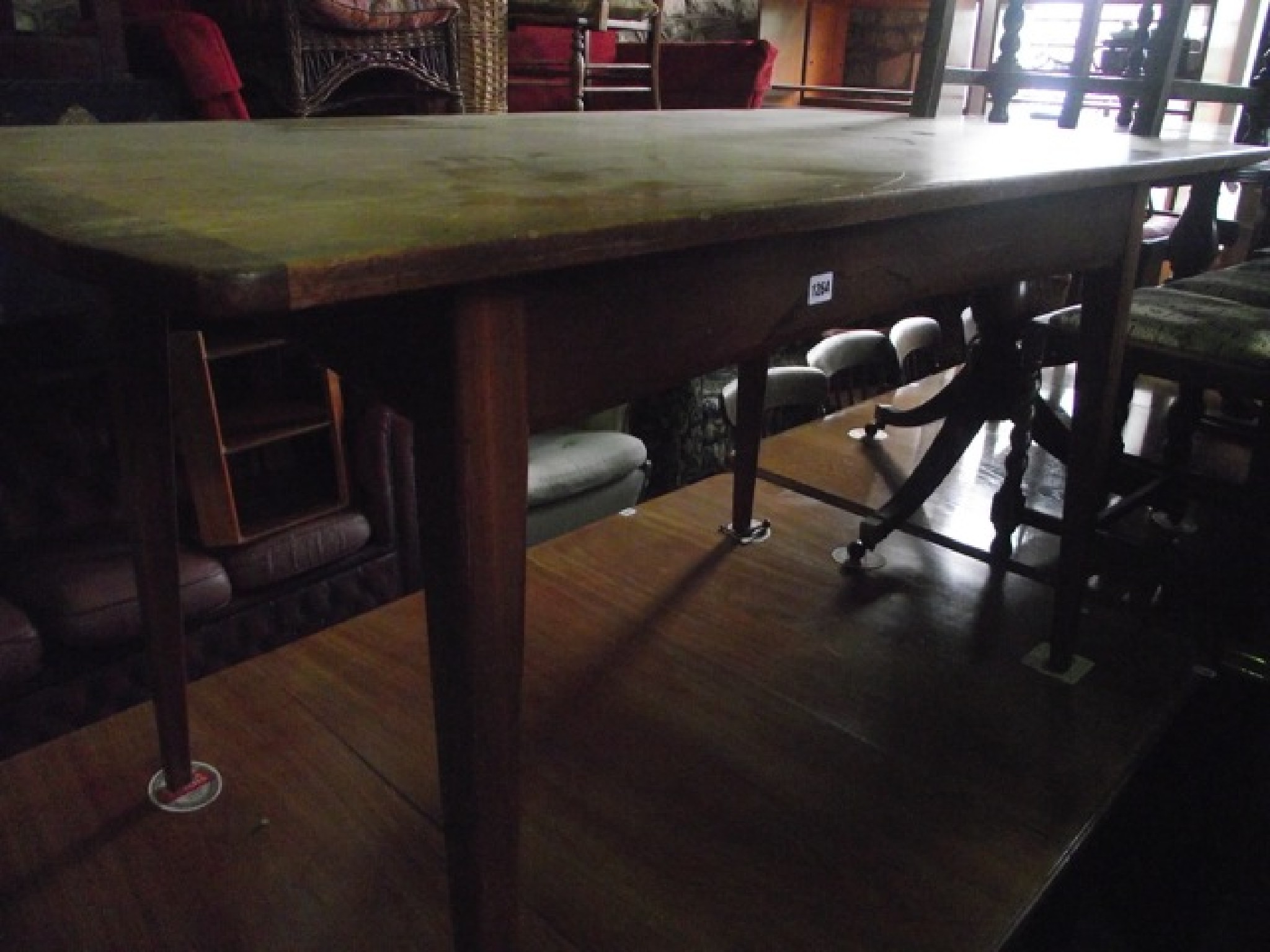 Appraisal: A mid th century teak dining table of rectangular form