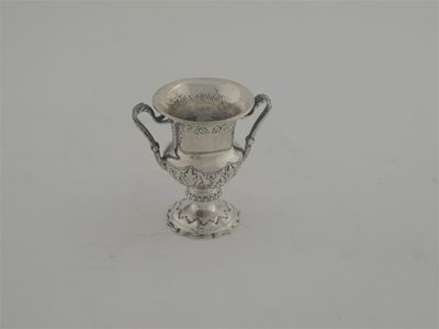 Appraisal: A small modern two handled trophy cup with chased decoration