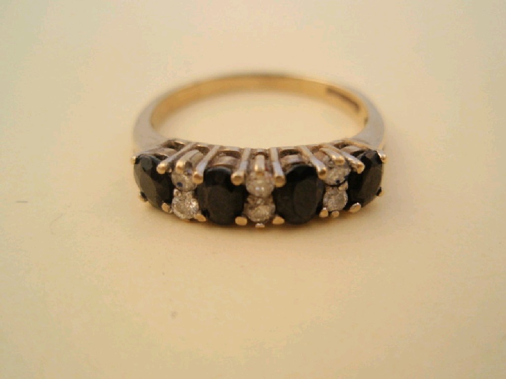 Appraisal: A ct gold dark blue stone and diamond half hoop