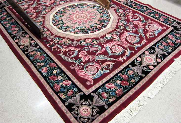 Appraisal: FINE HAND KNOTTED ORIENTAL CARPET a Sino-Aubusson centering a flower-filled