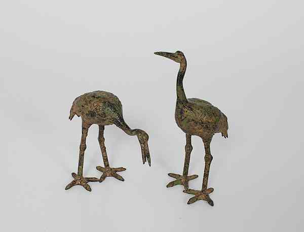 Appraisal: Bronze Cranes th century Two painted and gilded bronze standing