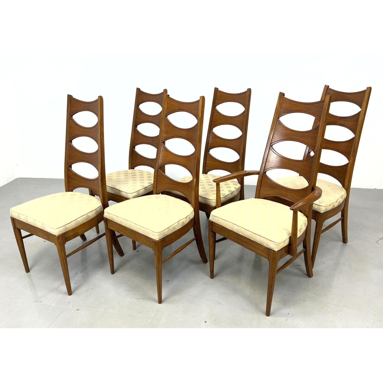 Appraisal: Kent Coffey cats eye ladder back walnut dining chairs unmarked