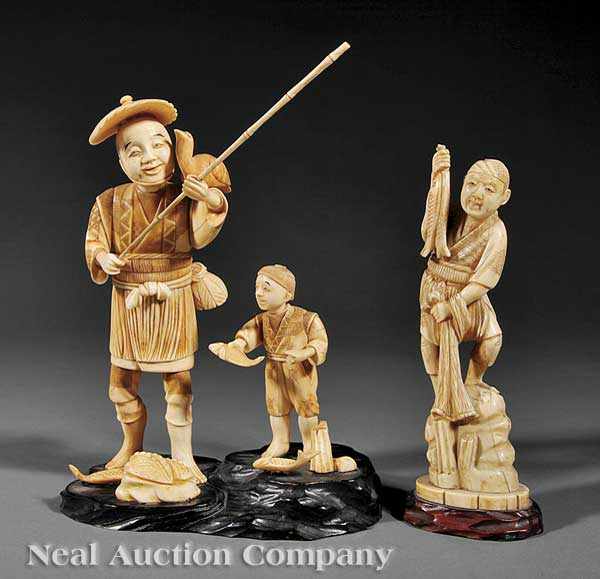 Appraisal: Two Japanese Ivory Figural Okimono the first a group comprised