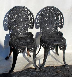 Appraisal: Pair of wrought iron garden chairs Pair of wrought iron