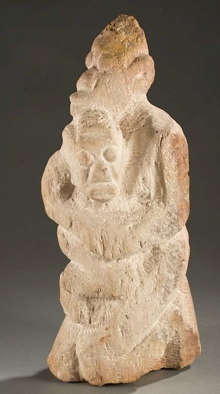 Appraisal: Dogon style kneeling stone maternity figure A stone kneeling maternity