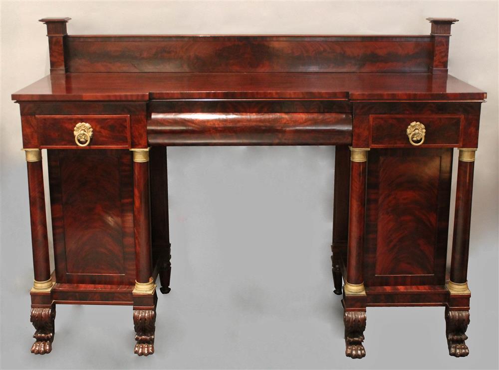 Appraisal: AMERICAN CLASSICAL FIGURED MAHOGANY PEDESTAL SIDEBOARD ca having a rectangular