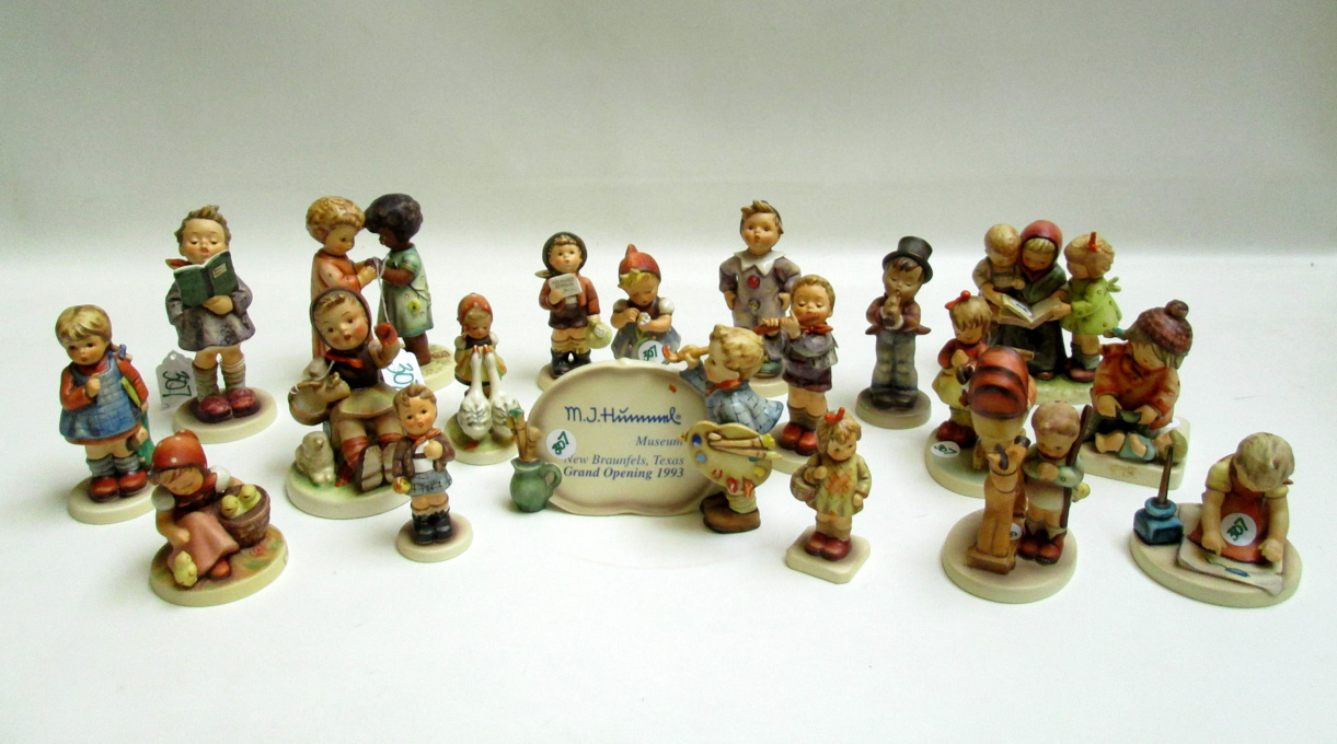 Appraisal: NINETEEN HUMMEL PORCELAINS trademarks from - TM- to TM- figurines