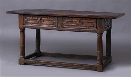 Appraisal: ITALIAN BAROQUE CARVED WALNUT SIDE TABLE The overhanging top above