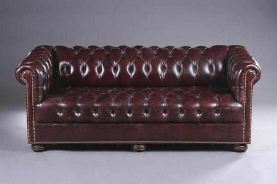 Appraisal: CHESTERFIELD TYPE BOX-FORM SOFA late th century Overscroll padded back