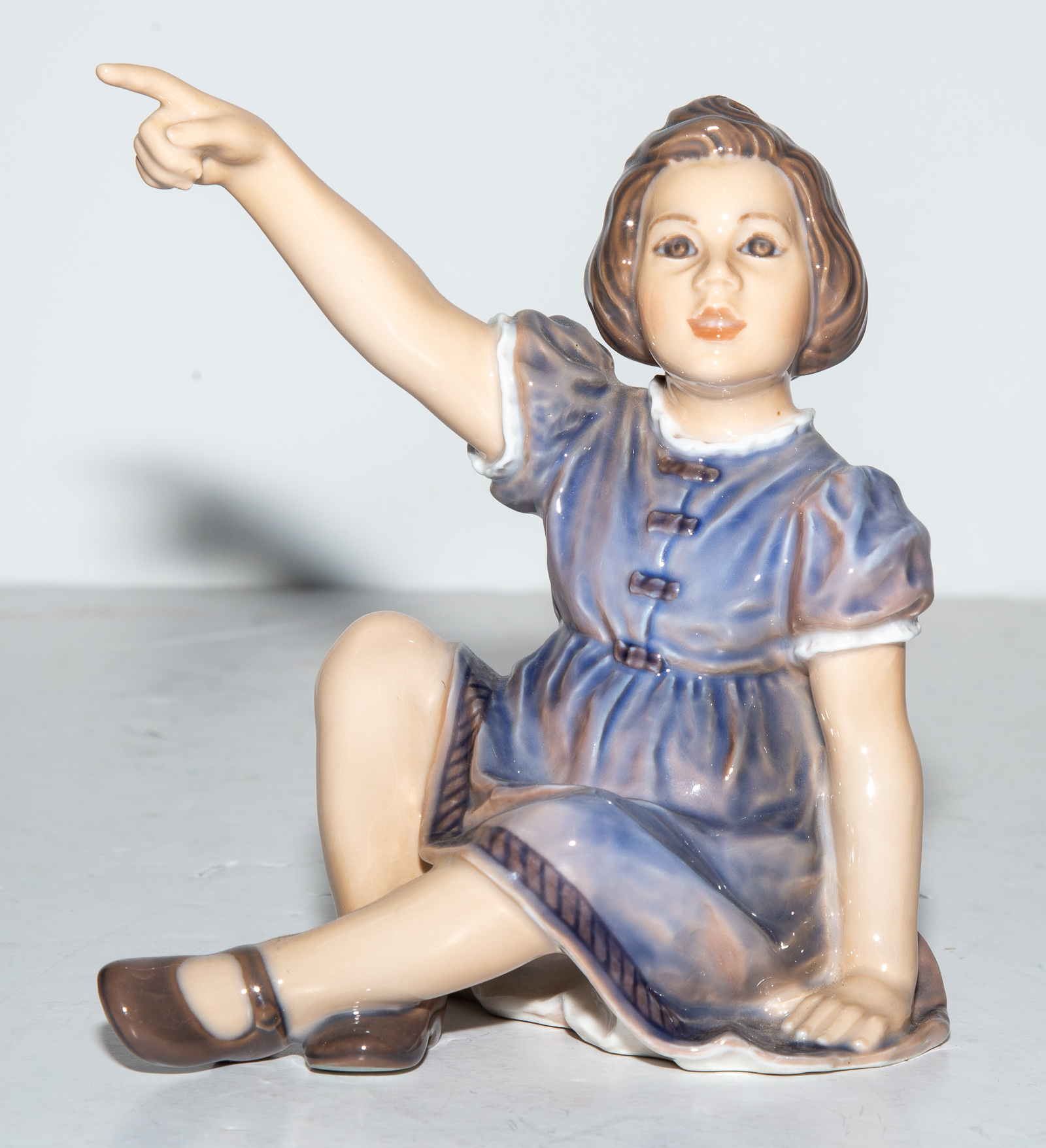 Appraisal: DAHL JENSEN COPENHAGEN PORCELAIN FIGURE Seated Girl Pointing