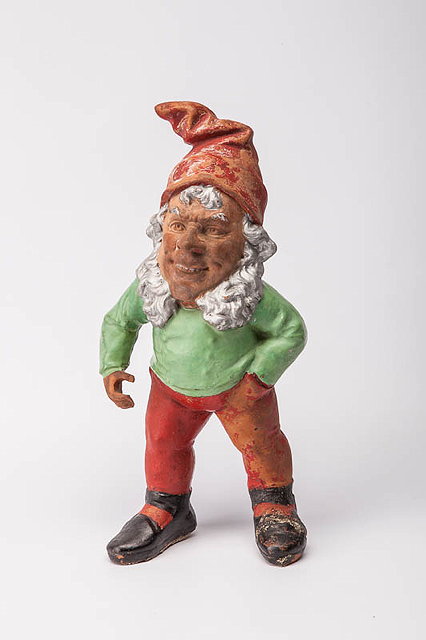 Appraisal: AN OLD TERRACOTTA AND PAINTED GARDEN GNOME with red pointed