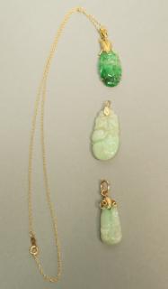 Appraisal: pc Asian Carved Jade Pendants One with gold cha pc