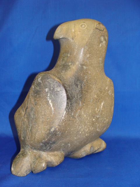 Appraisal: PAUTA SAILA Inuit b A mottled green soapstone figure of