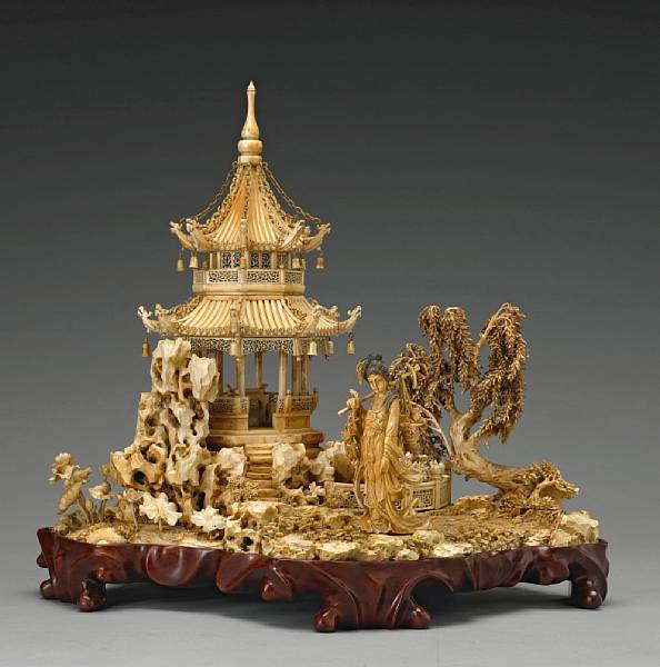 Appraisal: A pieced and tinted ivory model of a beauty in