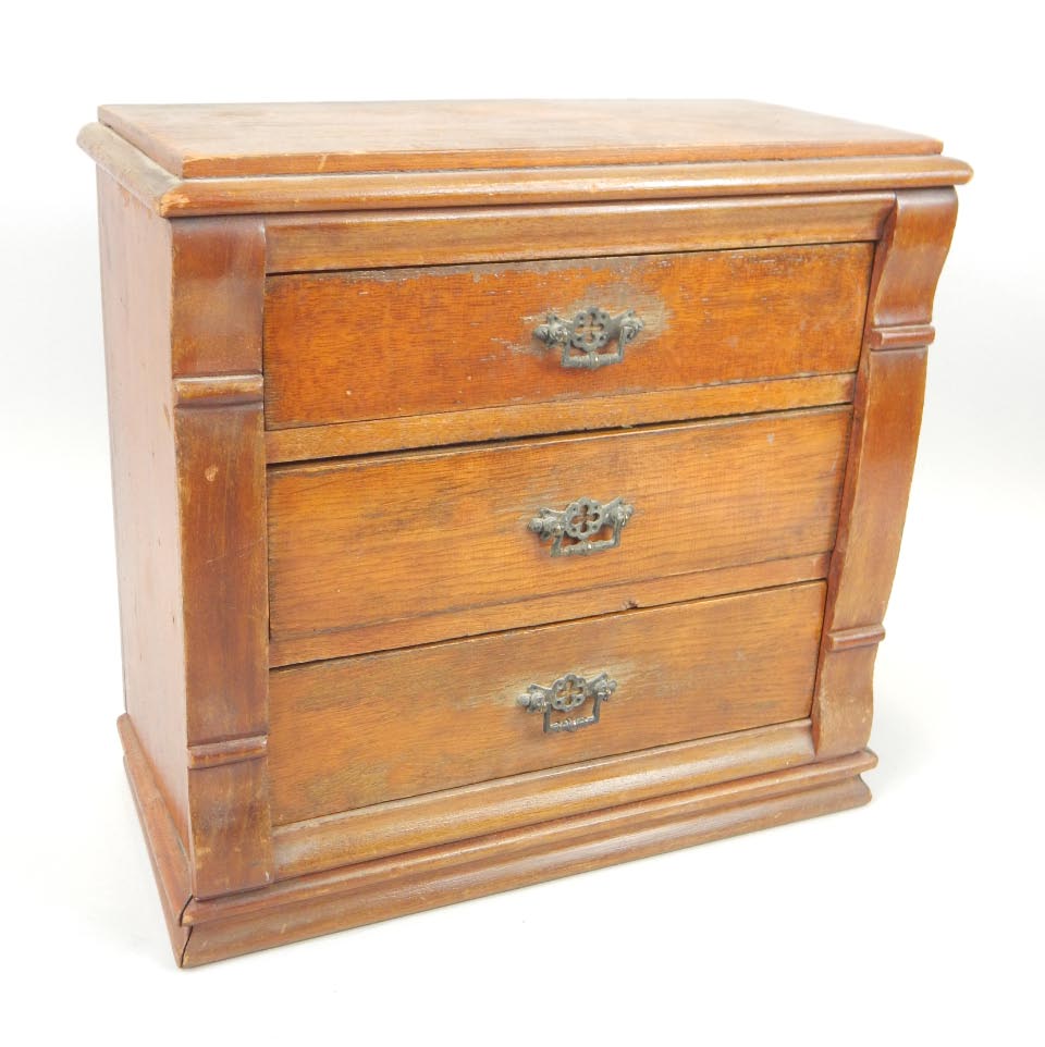 Appraisal: A late th-early thC stained pine miniature chest of drawers