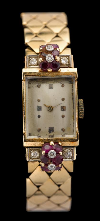 Appraisal: Lady's karat yellow gold diamond and ruby wristwatch Rectangular case