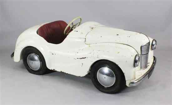 Appraisal: An Austin J pedal car in white with red seats