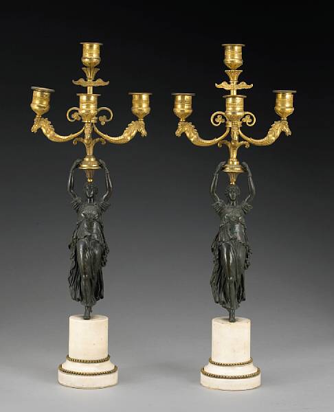 Appraisal: A pair of Empire patinated and gilt bronze figural four