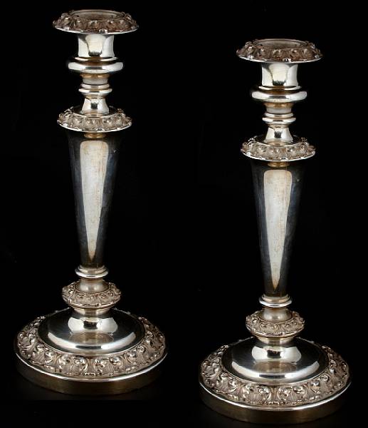 Appraisal: A George IV silver pair of weighted baluster form candlesticksWaterhouse