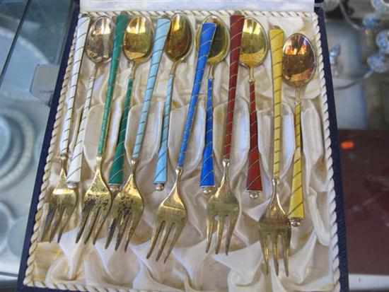 Appraisal: BOXED SET OF DANISH SILVER GILT AND ENAMEL H''ORDERVE FORKS