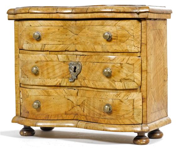 Appraisal: MINIATURE COMMODE Baroque Switzerland Walnut inlaid with reserves Brass mounts