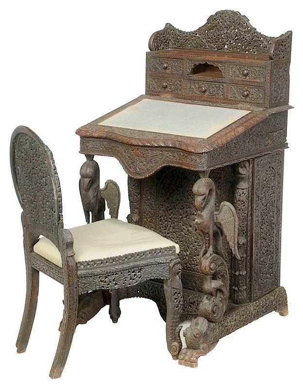 Appraisal: Anglo-Indian Carved Teak Davenport Desk Chair th century elaborately carved