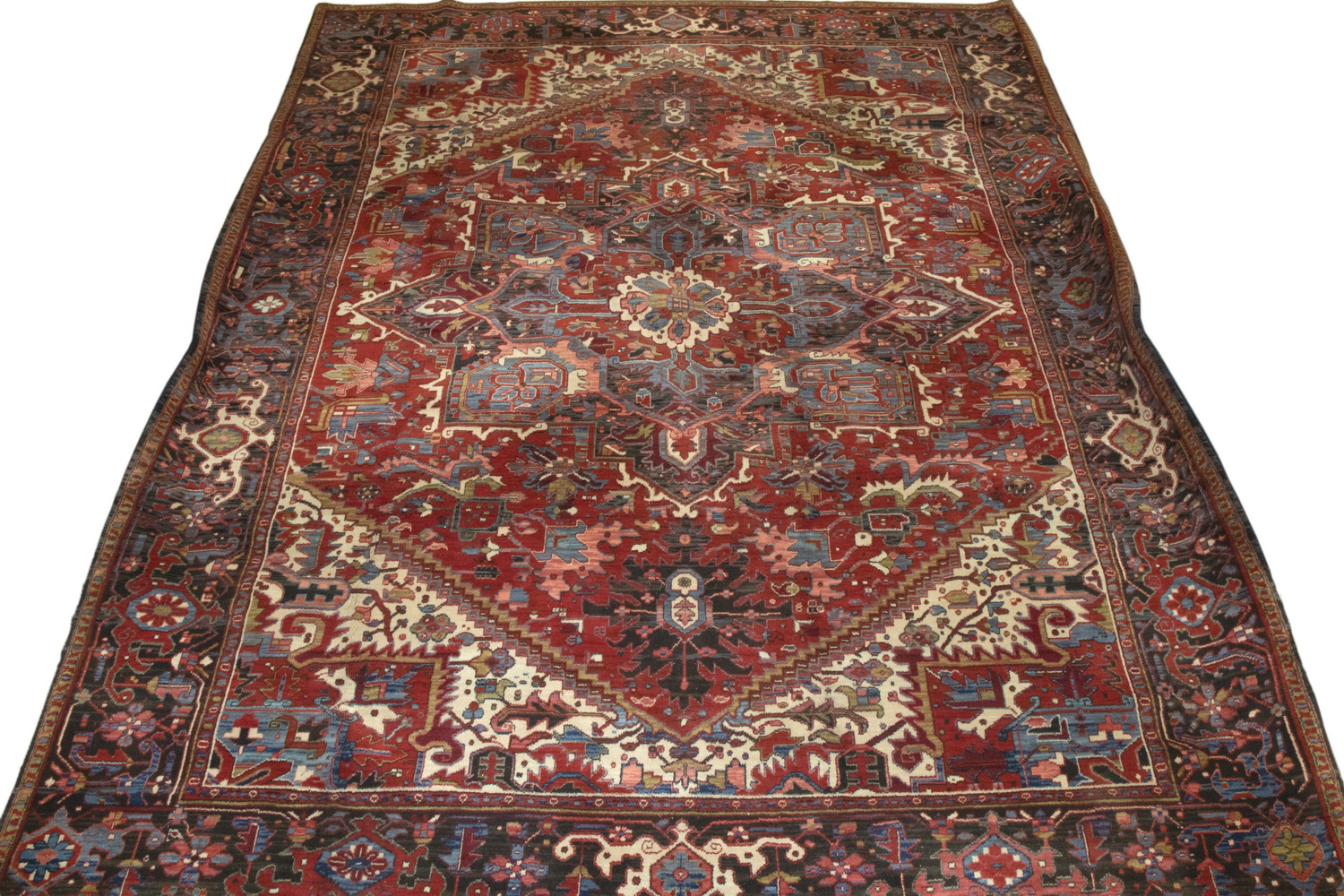 Appraisal: BELGIAN MACHINE MADE WOOL CARPET Made in the Persian Heriz