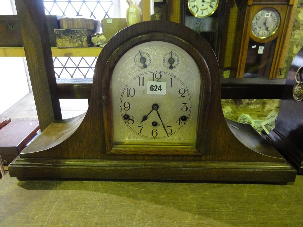 Appraisal: A large Edwardian oak top hat clock the arched silvered