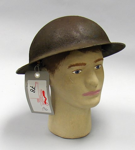 Appraisal: Lot consists of a US WWI Doughboy combat helmet Exterior