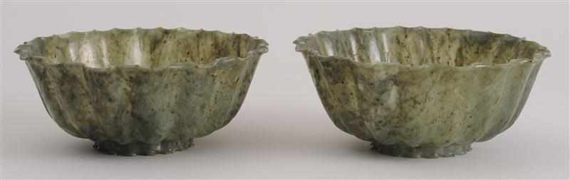 Appraisal: PAIR OF CHINESE ENGRAVED SPINACH GREEN JADE LOTUS BOWLS Each