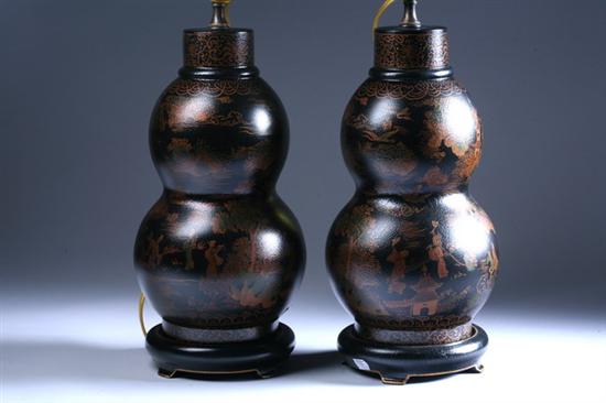 Appraisal: PAIR CHINESE BLACK LACQUERED WOOD DOUBLE-GOURD VASES Gold-painted to depict