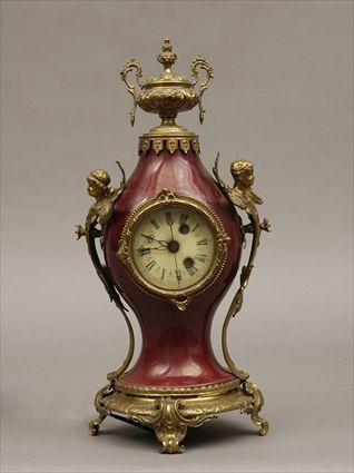 Appraisal: Warren Telechron Co Louis XV-Style Brass-Mounted Ox Blood-Glazed Ceramic Electric