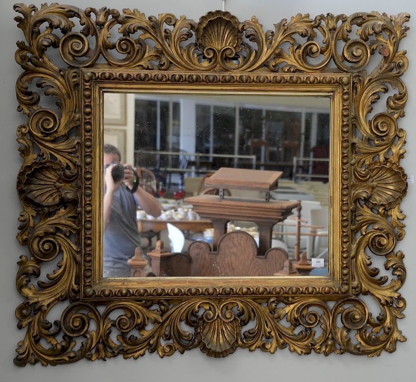 Appraisal: Victorian rectangular mirror with pierced scroll and shell frame one