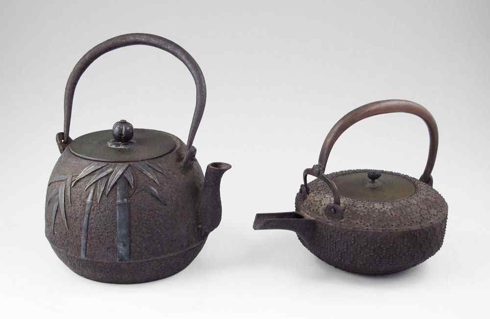 Appraisal: JAPANESE CAST IRON TEAPOTS To include Teapot with lid bamboo