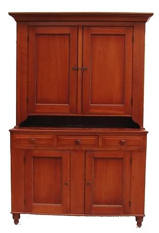 Appraisal: Cherry Two blind doors over a pie shelf three-drawer base