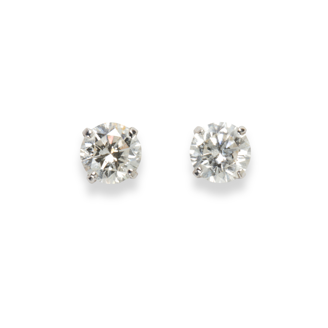 Appraisal: A PAIR OF DIAMOND AND FOURTEEN KARAT WHITE GOLD STUD