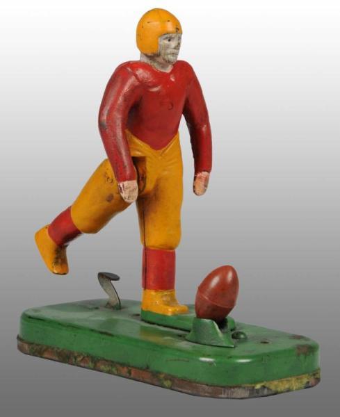 Appraisal: Cast Iron Football Kicking Toy Description American Red and yellow