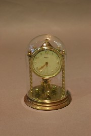 Appraisal: A Wurthner brass mantel clock in original glass dome