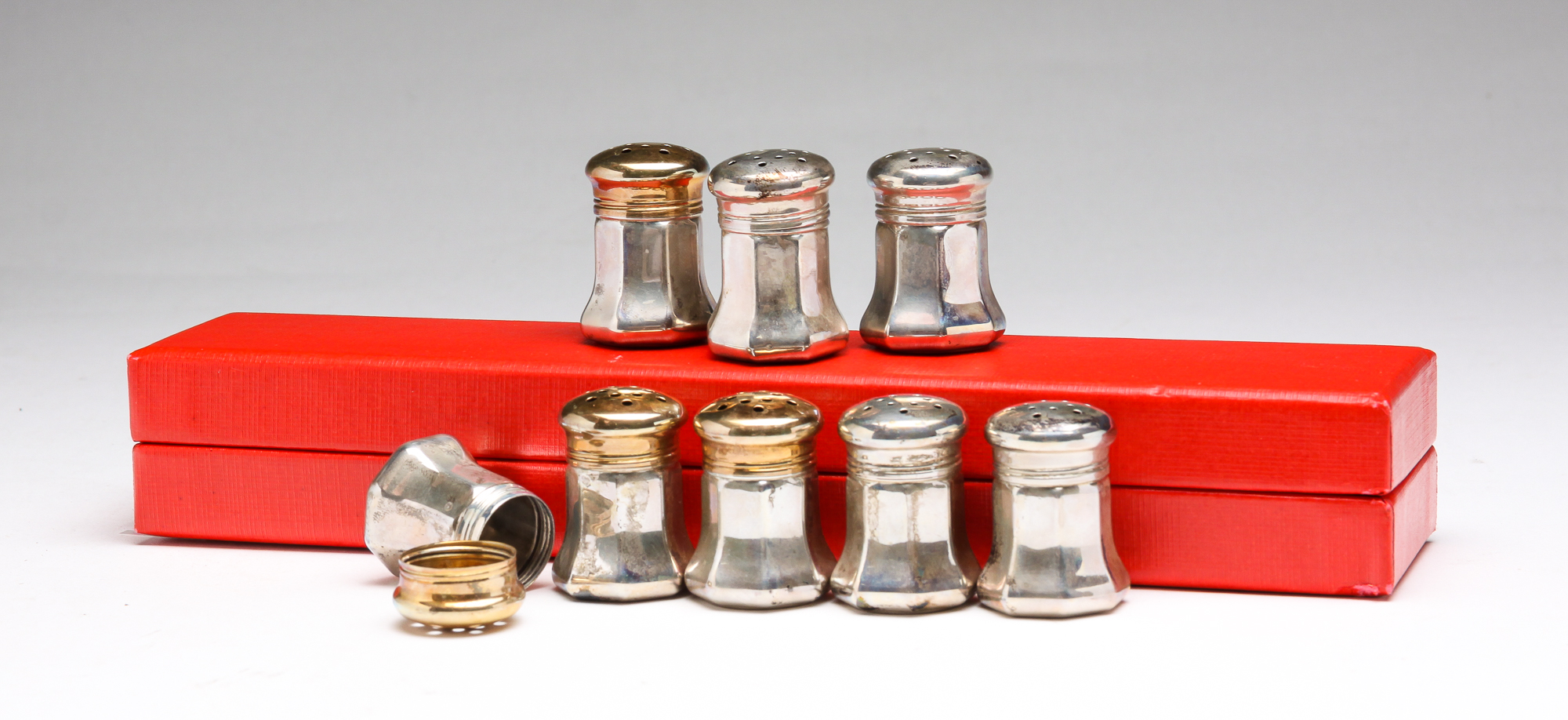 Appraisal: EIGHT CARTIER STERLING SALTS AND PEPPERS Twentieth century Four pepper