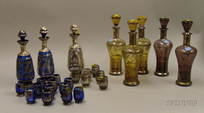 Appraisal: Eight Silver Overlaid Colored Blown Glass Decanters and Eighteen Cordials